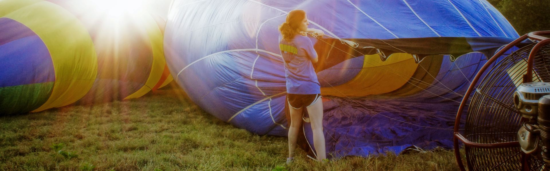 Girl assisting in inflating a hot air balloon