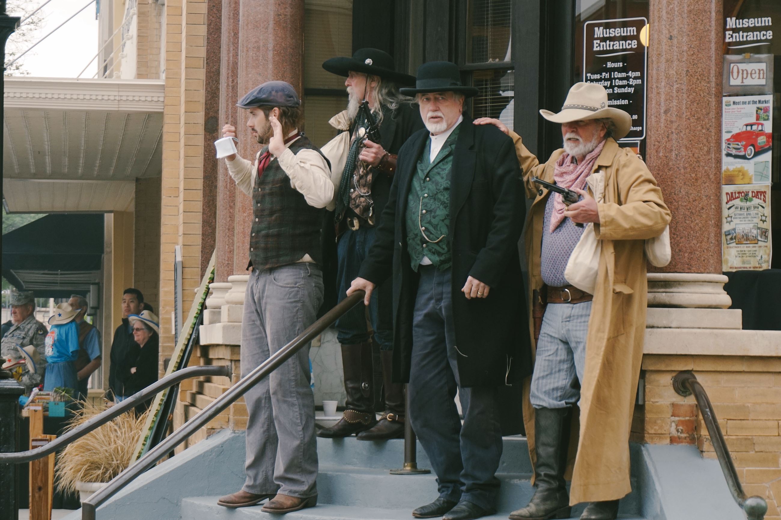Dalton Days Reeactment including 4 men dressed up in western wear acting out Dalton Days robbery 